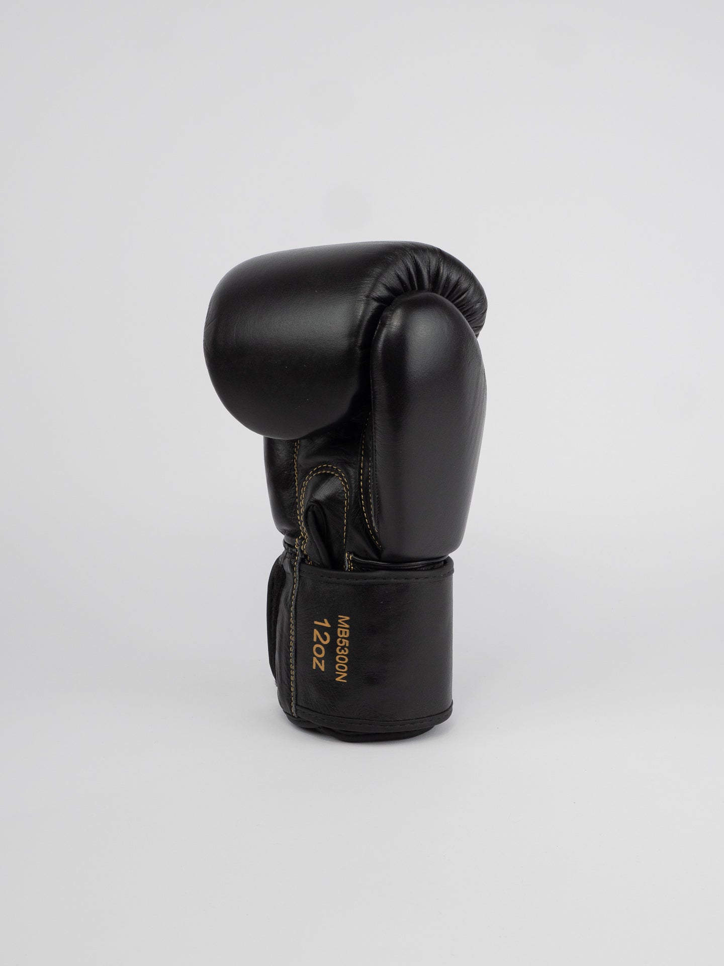 THAI SERIES BLACK GOLD LEATHER BOXING GLOVES